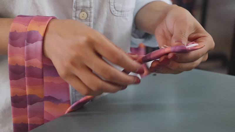 Woman manufacturing neckties