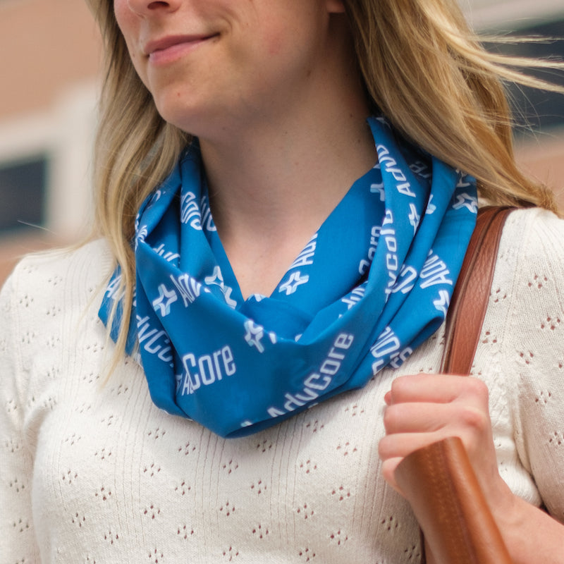 woman wearing a custom branded infinity scarf