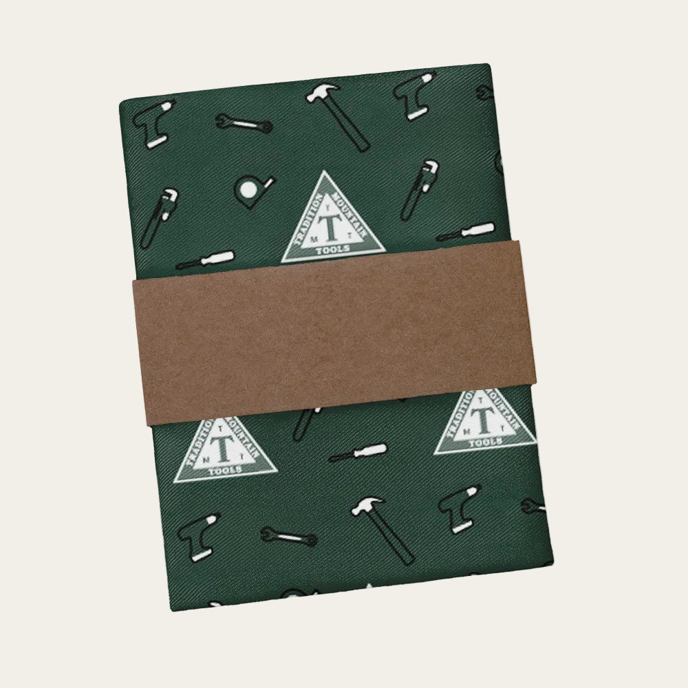 Green tool-themed pocket square with brown band.