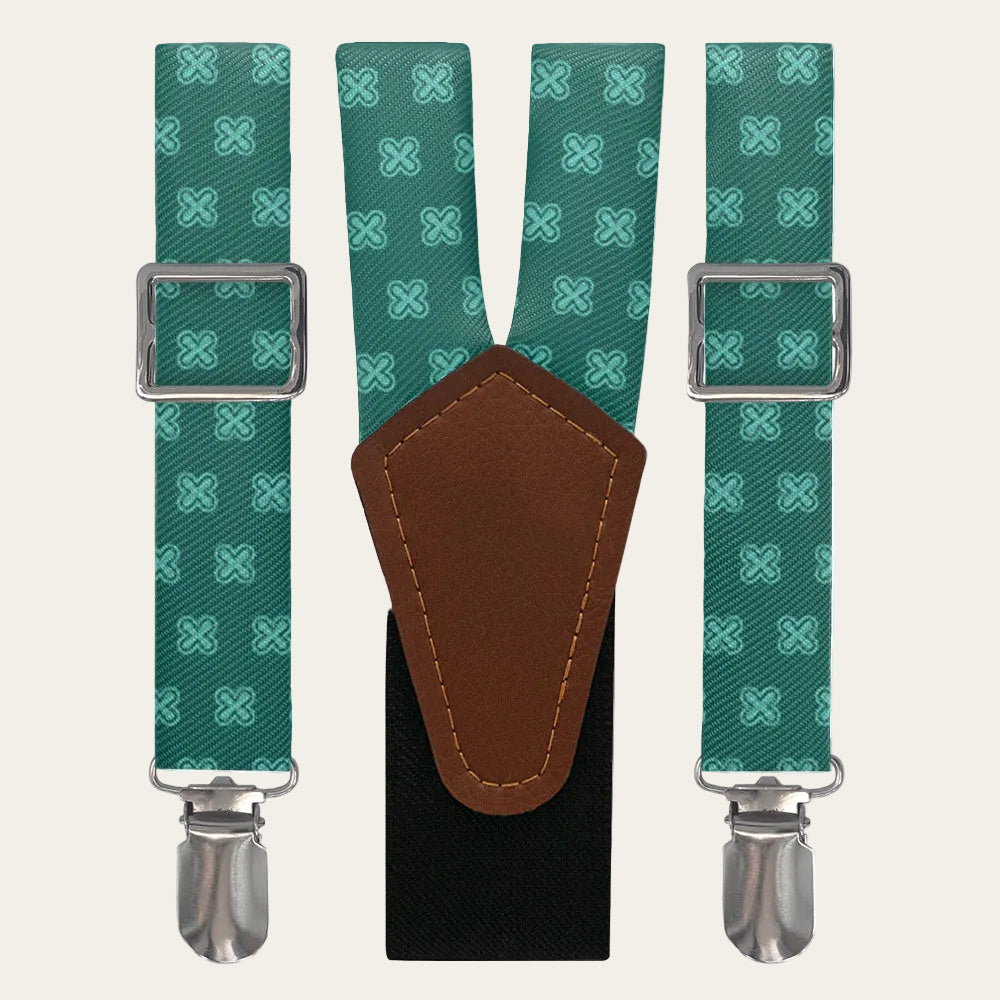 Green patterned suspenders with brown leather patch and silver clips on a white background
