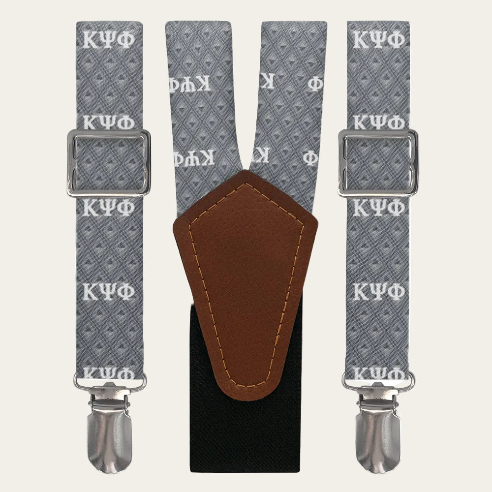 Gray suspenders with Kappa Psi Phi logo and brown leather patch on a white background