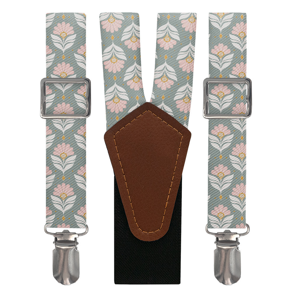 Floral patterned suspenders with brown leather y-back and silver clips on a white background