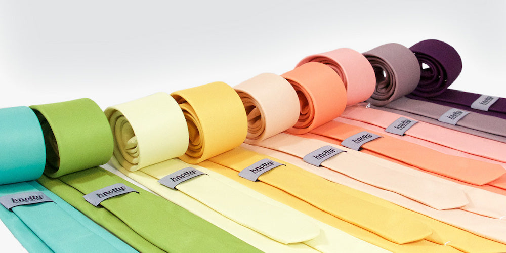 Set of colorful ties on white background