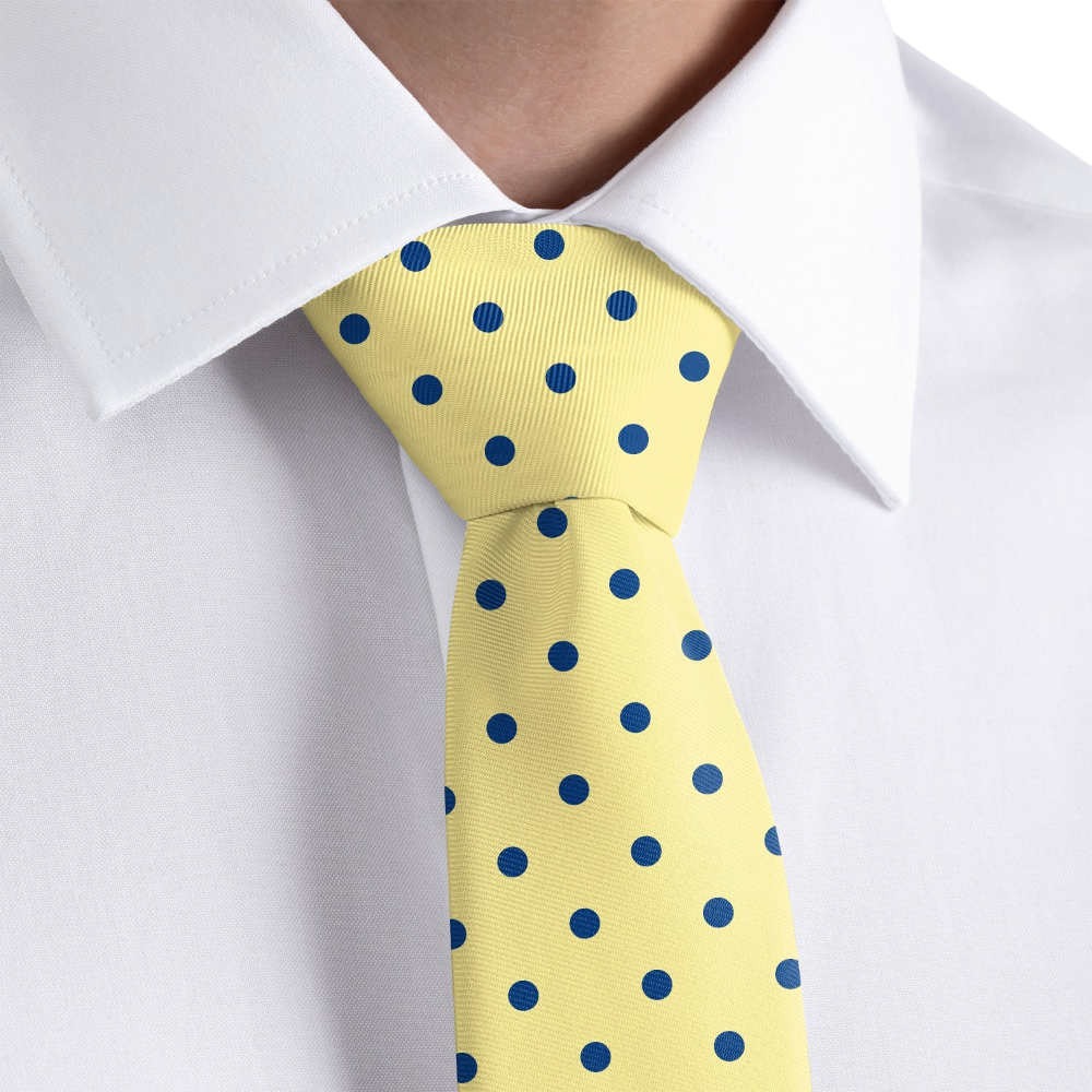 close up of yellow polka dot tie and a white shirt