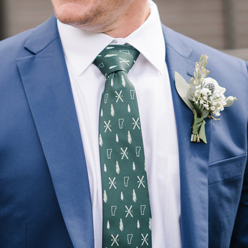close up of a person wearing a necktie at a wedding