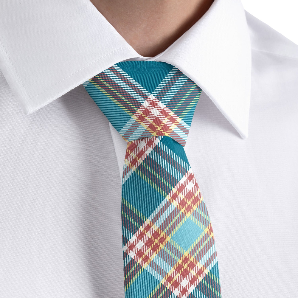 Plaid tie with blue, red, and yellow pattern on a white shirt