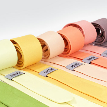 rolled neckties in a rainbow of colors matched to Azazie dresses